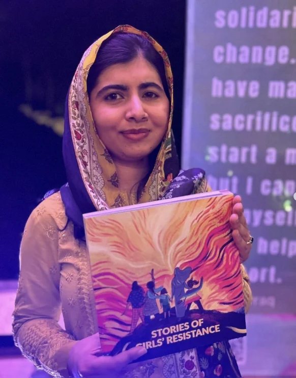 Malala Yousafzai holding Stories of Girls’ Resistance